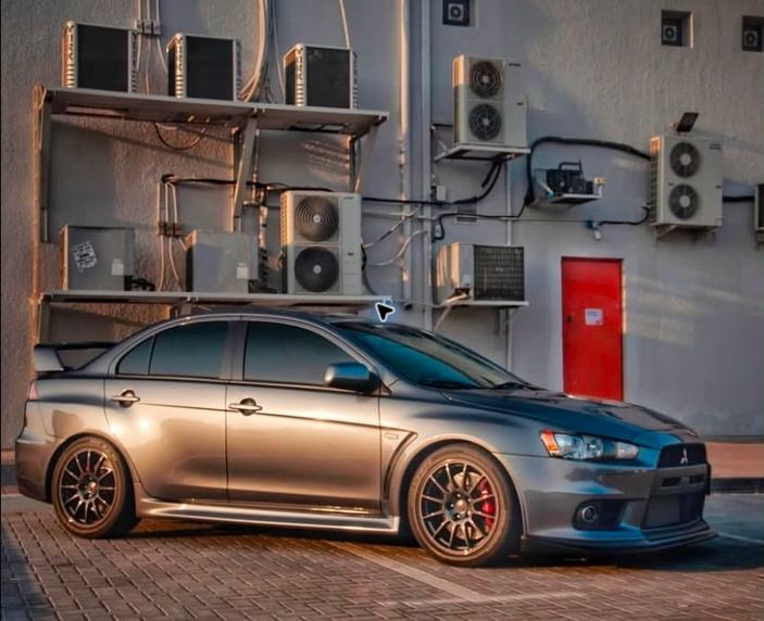 Silver Mitsubishi Evo X GSR customer build with bronze wheels